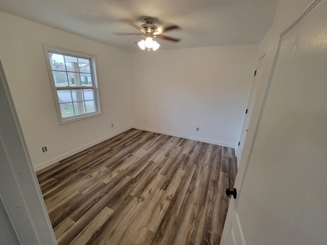 unfurnished room featuring ceiling fan and wood-type flooring