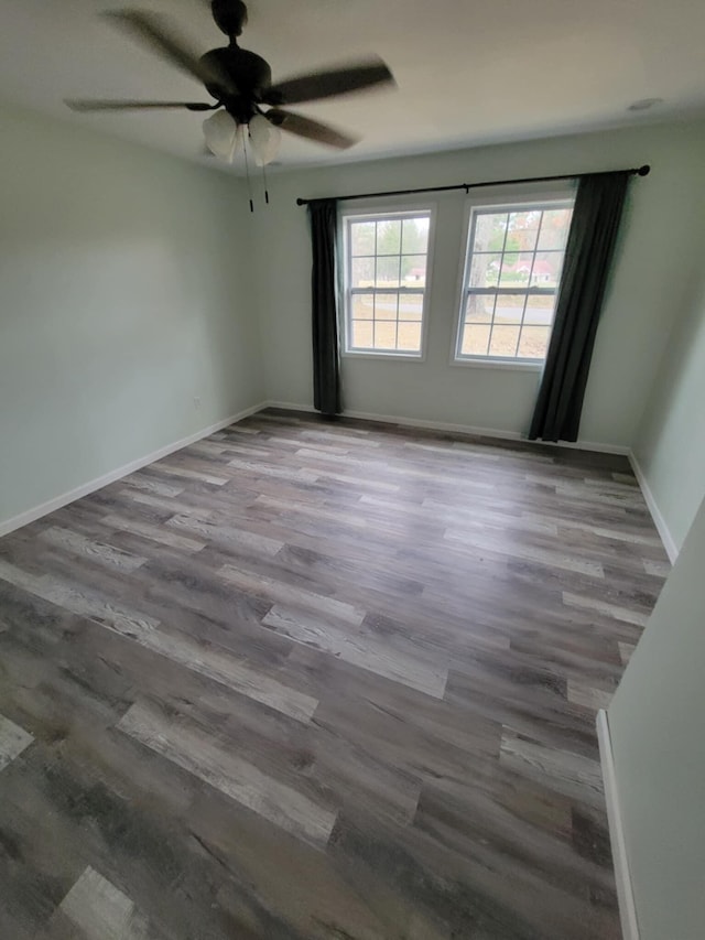 unfurnished room featuring hardwood / wood-style flooring and ceiling fan