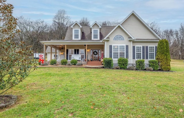 view of front of house featuring covered porch, a front lawn, and ceiling fan