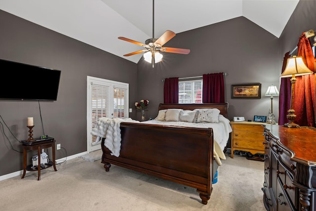 bedroom featuring ceiling fan, lofted ceiling, light carpet, and multiple windows