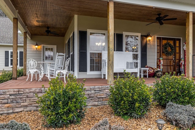 entrance to property featuring ceiling fan and covered porch