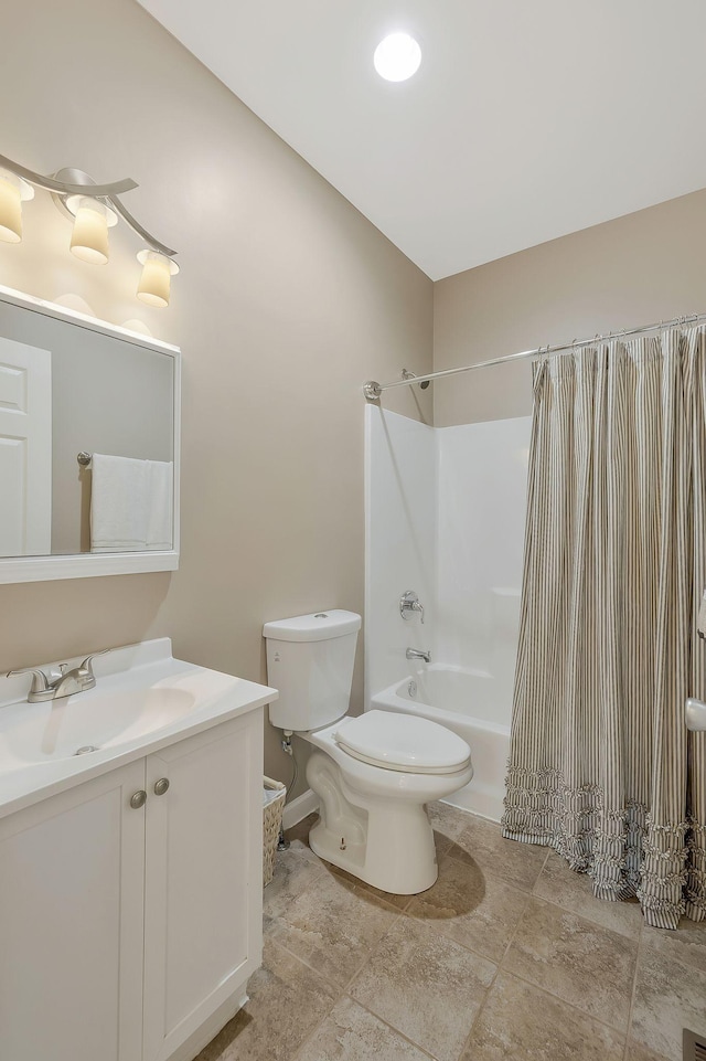 full bath featuring toilet, shower / tub combo with curtain, and vanity