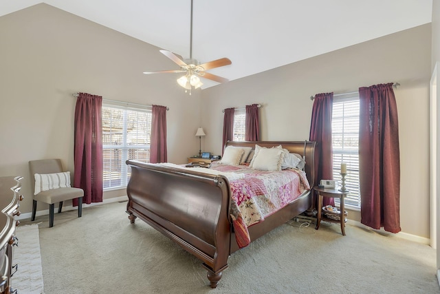 bedroom with vaulted ceiling, carpet floors, and baseboards