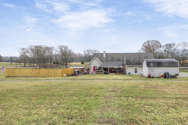 exterior space featuring an outbuilding and a storage unit