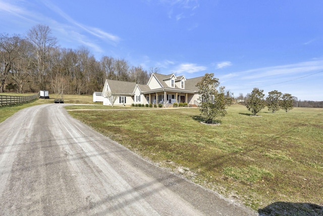 view of front of home featuring a front yard and covered porch