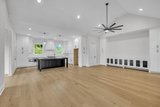 521 Matthew Miller Dr, Smyrna, TN 37167 - unfurnished living room with a ceiling fan, light wood-style flooring, recessed lighting, and lofted ceiling
