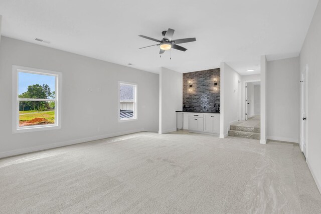 521 Matthew Miller Dr, Smyrna, TN 37167 - unfurnished bedroom featuring bar, light colored carpet, multiple windows, and a ceiling fan