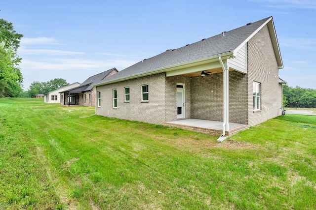 521 Matthew Miller Dr, Smyrna, TN 37167 - rear view of house with a patio, a lawn, brick siding, and a ceiling fan