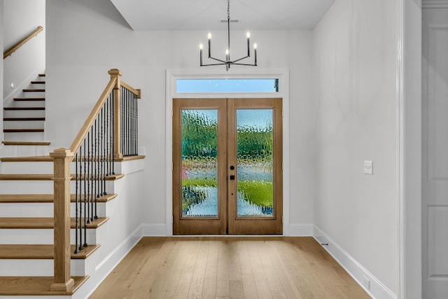 521 Matthew Miller Dr, Smyrna, TN 37167 - foyer entrance featuring stairs, french doors, a chandelier, and hardwood / wood-style flooring