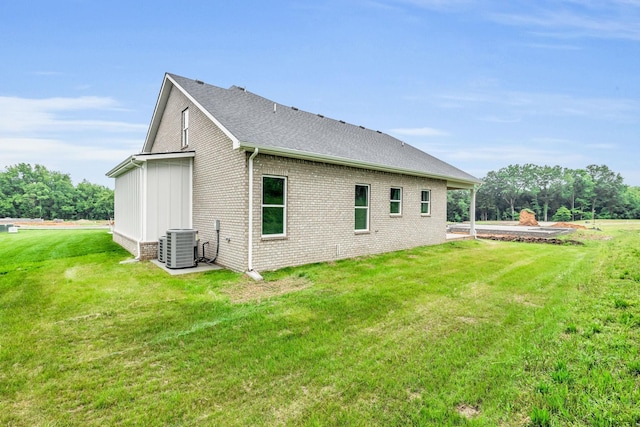521 Matthew Miller Dr, Smyrna, TN 37167 - rear view of house with a yard, brick siding, and a shingled roof