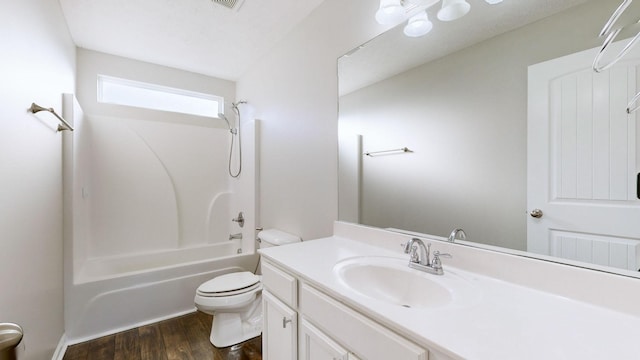 full bathroom featuring vanity,  shower combination, hardwood / wood-style flooring, and toilet