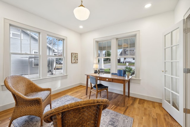 office with light hardwood / wood-style floors