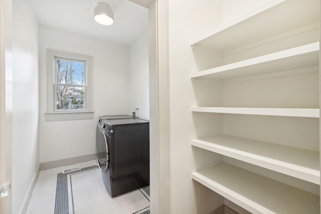 washroom featuring tile patterned floors and independent washer and dryer