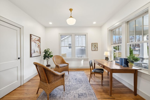 office space with light hardwood / wood-style floors