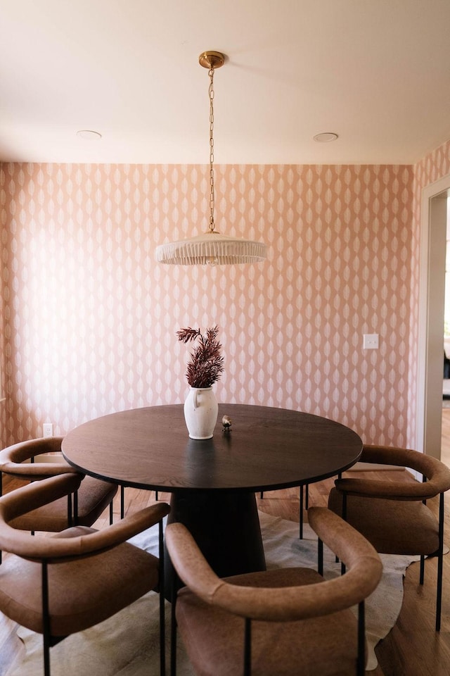 dining area with hardwood / wood-style floors