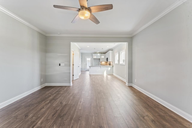 unfurnished living room featuring crown molding, ceiling fan, and dark wood-type flooring