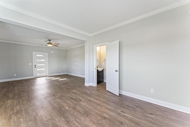 unfurnished room featuring dark hardwood / wood-style floors, ceiling fan, and ornamental molding