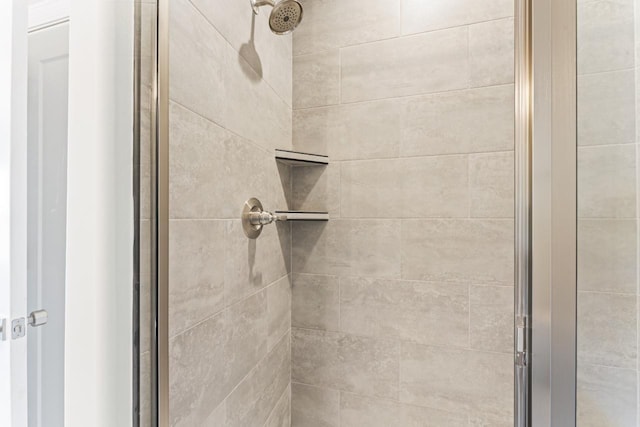 bathroom featuring an enclosed shower