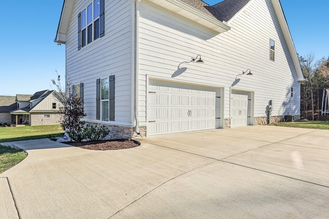 view of side of property with a garage