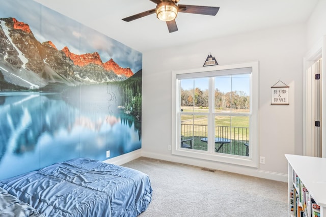 carpeted bedroom with ceiling fan