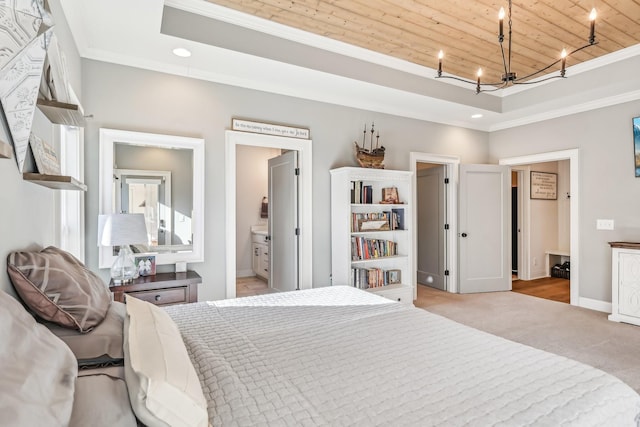 carpeted bedroom with a chandelier, wood ceiling, crown molding, and ensuite bath