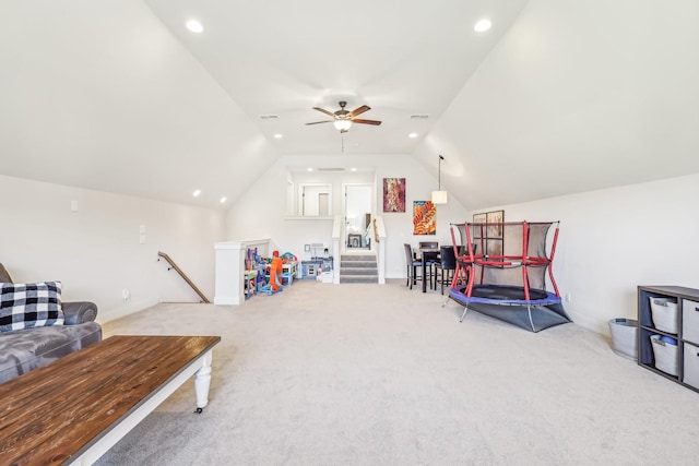 recreation room with light carpet, ceiling fan, and lofted ceiling