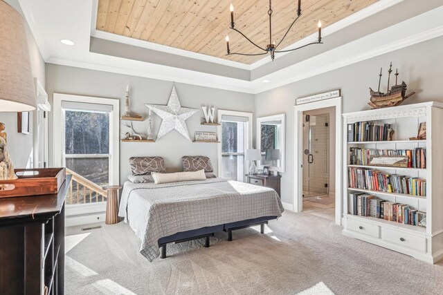 carpeted bedroom with ornamental molding, a raised ceiling, wooden ceiling, a notable chandelier, and connected bathroom