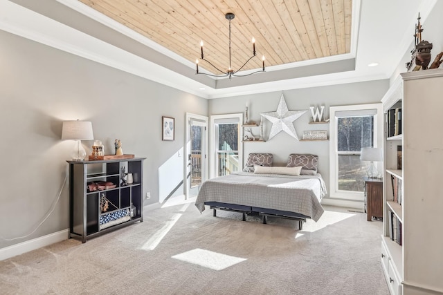 carpeted bedroom with a notable chandelier, a raised ceiling, wood ceiling, and ornamental molding