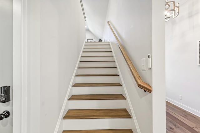 stairway featuring hardwood / wood-style floors