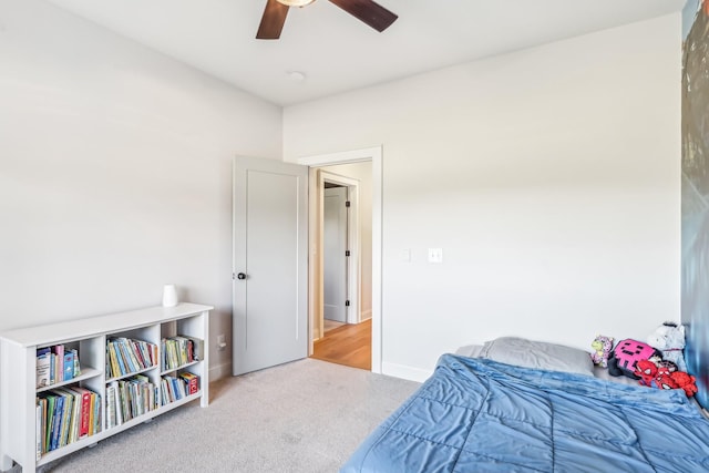 carpeted bedroom featuring ceiling fan