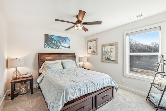 bedroom with ceiling fan and light colored carpet