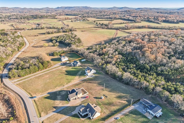 drone / aerial view featuring a mountain view and a rural view