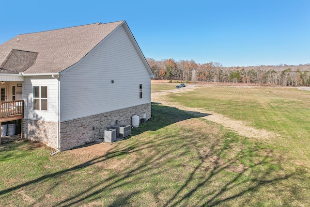 view of side of home featuring a lawn