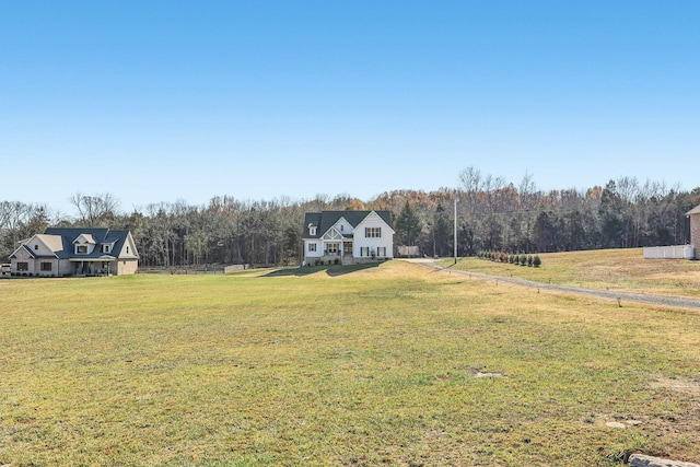 view of yard with a rural view