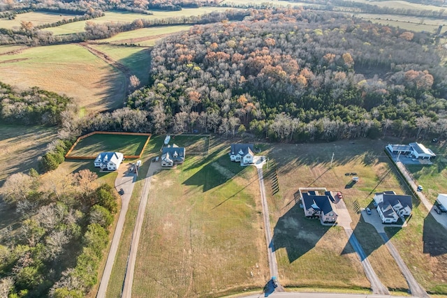 birds eye view of property featuring a rural view