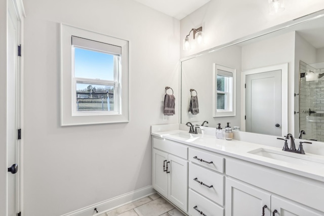 bathroom with tile patterned flooring, vanity, and a shower with shower door