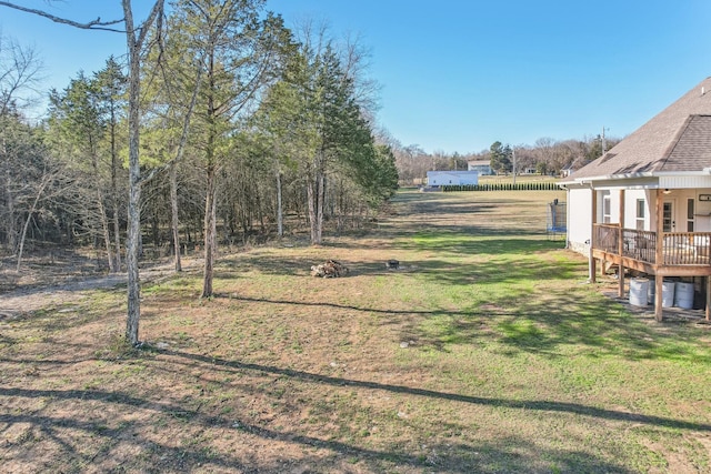 view of yard featuring a wooden deck