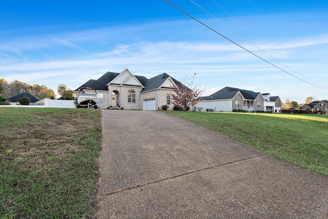 view of front of property with a front lawn and a garage