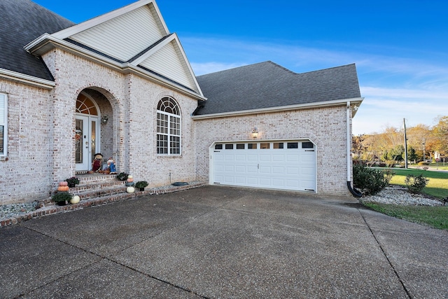 view of side of property with a garage