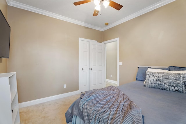 bedroom featuring ceiling fan, light colored carpet, and crown molding