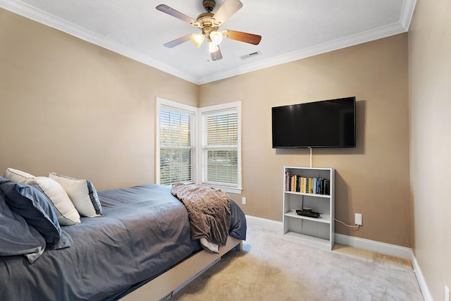 bedroom with ceiling fan, crown molding, and light carpet