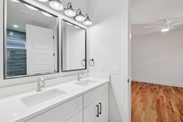 bathroom featuring hardwood / wood-style floors, vanity, and ceiling fan