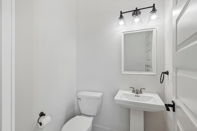 bathroom featuring toilet and sink