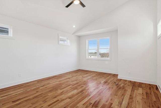 spare room featuring ceiling fan, light hardwood / wood-style floors, and high vaulted ceiling