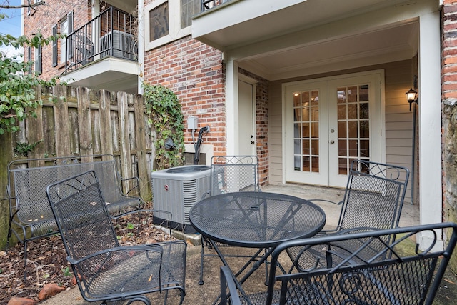 view of patio featuring cooling unit and french doors