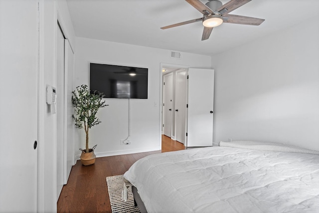 bedroom with ceiling fan and wood-type flooring