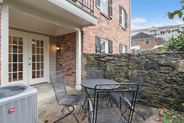 view of patio / terrace featuring french doors and central AC