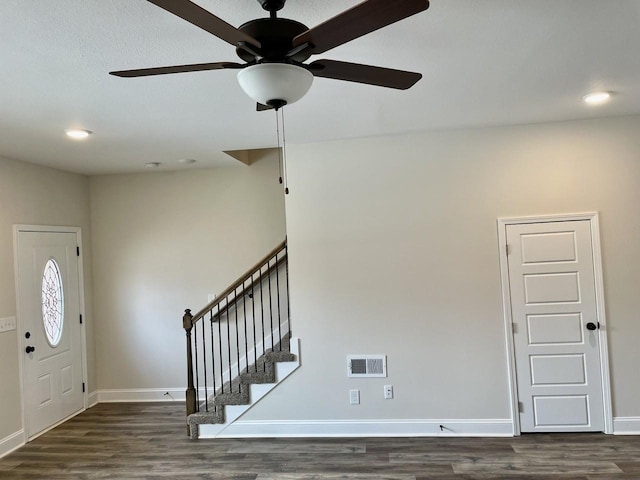 entrance foyer with ceiling fan and dark hardwood / wood-style flooring