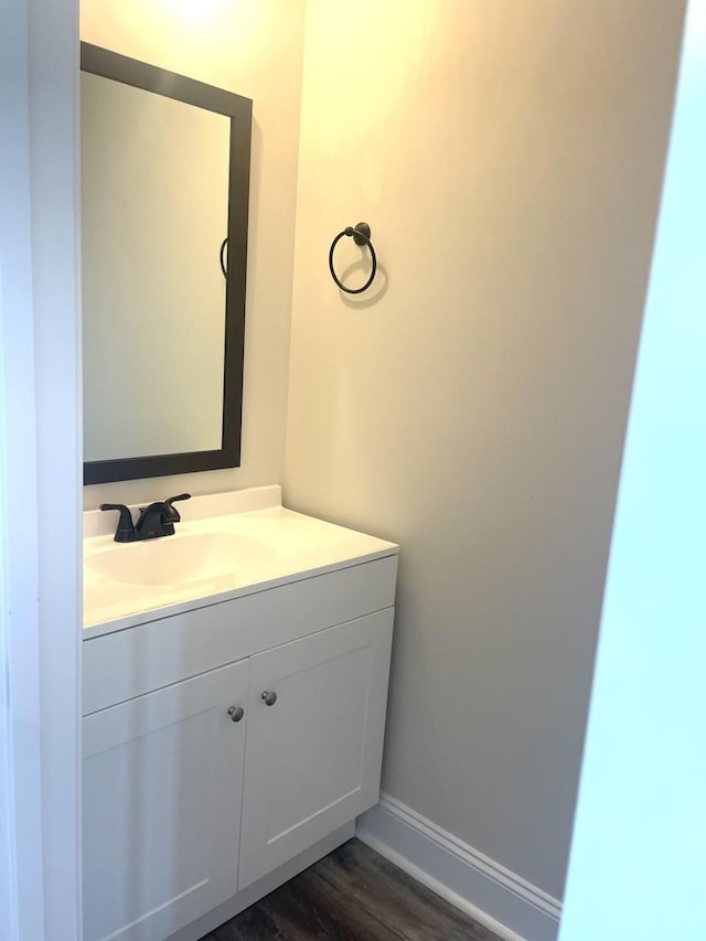 bathroom with vanity and wood-type flooring