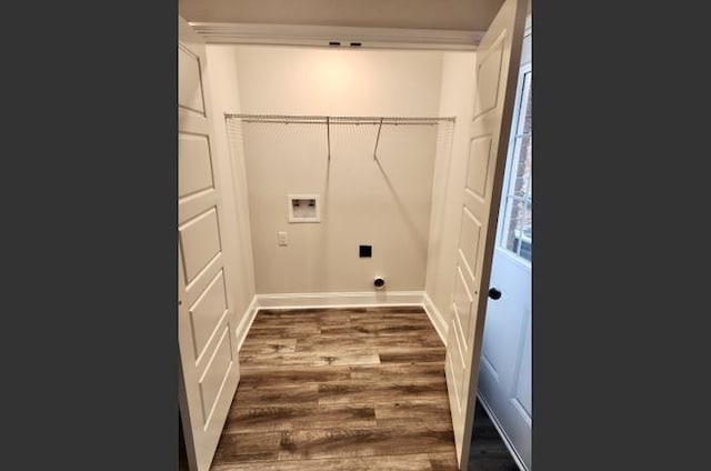 laundry room featuring dark hardwood / wood-style flooring and hookup for a washing machine